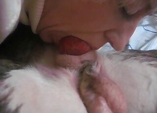 Mature broad is filmed by husband while deepthroating stiff dog cock