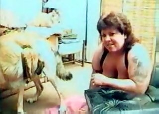 Chubby whore sucks dog's shaft during an exciting XXX zoo action